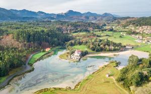 an aerial view of a river with a house at NUEVO Loylla Niembro a 500 m de la playa in Niembro