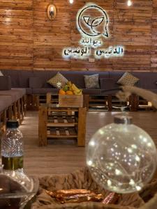 a room with a table with a glass ball on a table at إستراحة الدنيس الونيس in Riyadh