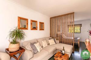 a living room with a couch and a table at Town house with jacuzzi and foosball table in Viñuela