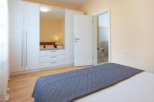 Letto o letti in una camera di Apartments Melody
