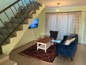 Et tv og/eller underholdning på Tintswalo Elegant Apartments