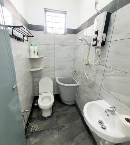 a bathroom with a toilet and a sink at (New)Jovial Cozy&Stylish House 4Room@BM Sri Rambai in Bukit Mertajam