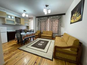 a living room with a couch and a table at Leones Villa in Pogradec