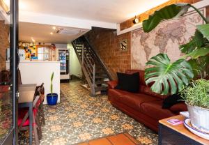 a living room with a couch and a staircase at Mambo Tango in Barcelona