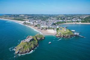 an aerial view of an island in the ocean at Flat 2 - 2 Bedroom Apartment - Tenby in Tenby