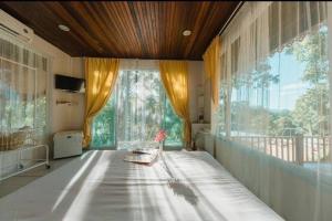 Un pat sau paturi într-o cameră la Baanpufa Resort