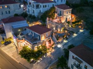 an aerial view of a mansion at night at Kalimera Andros in Andros