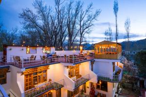 a view of a building with a balcony at Rainbow Hostelier in Leh