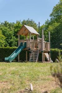 a playground with a slide and a gazebo at The Wishful Thinker in Kent