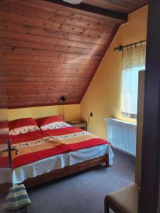 Postel nebo postele na pokoji v ubytování Agave Apartman