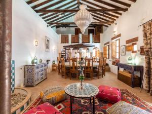 a living room with a table and a dining room at Molino Bajo in Melegis