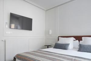 Postel nebo postele na pokoji v ubytování Pitipombo by FeelFree Rentals