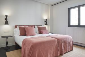 Postel nebo postele na pokoji v ubytování Pitipombo by FeelFree Rentals