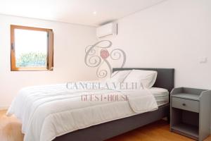 Ένα ή περισσότερα κρεβάτια σε δωμάτιο στο Cancela Velha Guest•House