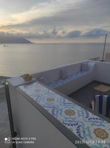 a view of the ocean from the deck of a boat at Appartamento Rocche Rosse in Acquacalda