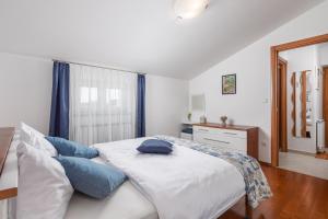 Posteľ alebo postele v izbe v ubytovaní Rona Apartment JM 38