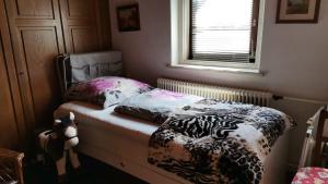 Łóżko lub łóżka w pokoju w obiekcie Ferienhaus Inselweg