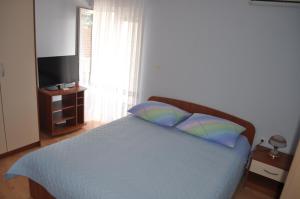 Postel nebo postele na pokoji v ubytování Apartments Zora