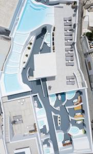 an aerial view of a resort with a swimming pool at White Concept Caves in Fira