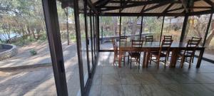 a dining room with a table and chairs at Casa Cara Resort in Parys