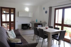 a living room with a table and a couch at Casa Sole in Rudalza