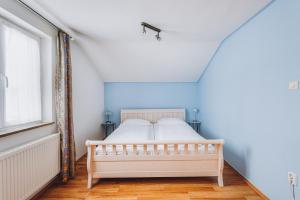 Postel nebo postele na pokoji v ubytování Weidegg - Hotel Garni