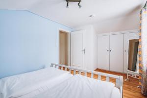 Postel nebo postele na pokoji v ubytování Weidegg - Hotel Garni