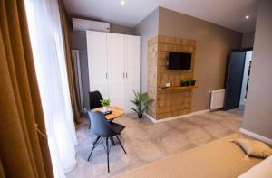 TV a/nebo společenská místnost v ubytování Casa Doner Rooms