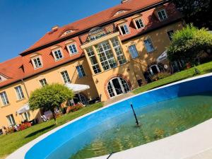 a swimming pool in front of a building at Schloss Zehdenick in Zehdenick