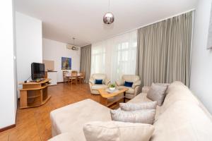 Телевизор и/или развлекательный центр в Apartments Adeona