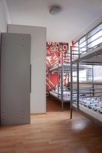 a room with several bunk beds in a room at SweetDream Guesthouse in Helsinki