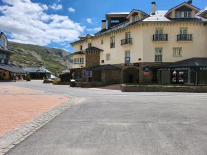 an empty street in front of a large building at dornajo en la plaza in Sierra Nevada