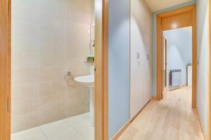 a bathroom with a shower and a sink and a toilet at Apartamento El Rincón del Chupinazo in Pamplona +22 photos