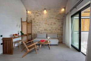 a living room with a couch and a table at Balos Beach in Kissamos