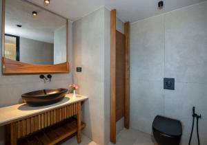 a bathroom with a sink and a mirror at Balos Beach in Kissamos