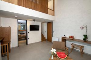 an open living room with a staircase and a living room at Balos Beach in Kissamos