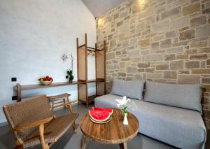 a living room with a couch and a table at Balos Beach in Kissamos