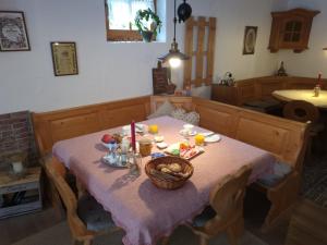 a table with a basket of fruit on it at Fagererhof in Bad Reichenhall +11 photos
