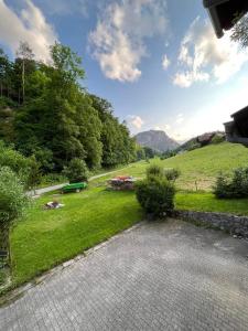 a view of a garden with a field and trees at Fagererhof in Bad Reichenhall