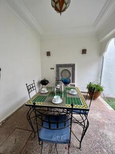 a table and chairs in a room with a table at Zina in Marrakesh