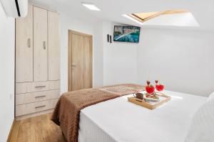 Postel nebo postele na pokoji v ubytování Apartment Petar 2 + 24 fotografií