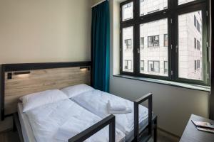 Posteľ alebo postele v izbe v ubytovaní a&o Budapest City