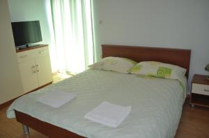 Postel nebo postele na pokoji v ubytování Apartments Zora