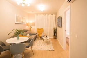a living room with a couch and a table at Luxury & Cosy City Center (4pax)-Wifi in Málaga