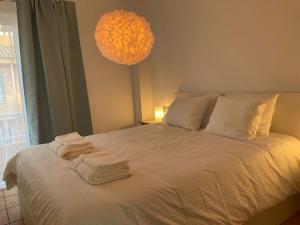 a bedroom with a bed with towels on it at Bella vista in Corralejo +19 photos