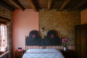 Postel nebo postele na pokoji v ubytování B&B il mio Casale