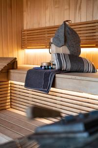 a sauna with two towels sitting on top of it at Lazy House Klaipeda in Klaipėda