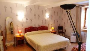 Tempat tidur dalam kamar di La franpierre