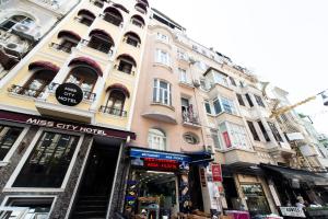 a tall building with a store in front of it at 1st FLOOR STUDIO in TAKSİM NEAR İSTİKLAL STREET in Istanbul