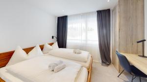 Voodi või voodid majutusasutuse Family Holiday Apartment Krone Churwalden toas